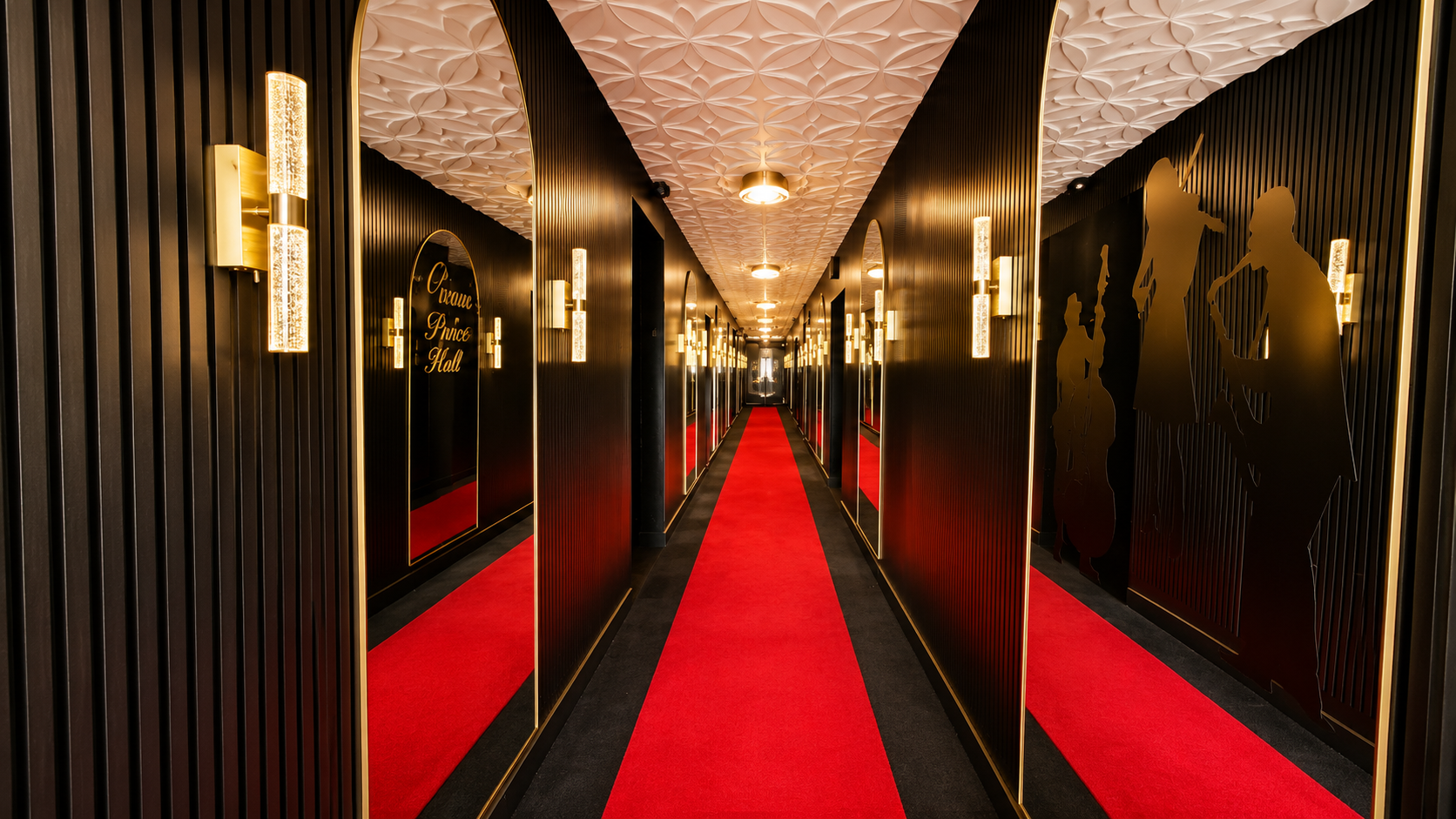 The gold-lit mirrored grand entrance at Crown Prince Event Hall